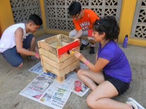 Lick students work on planter boxes they made